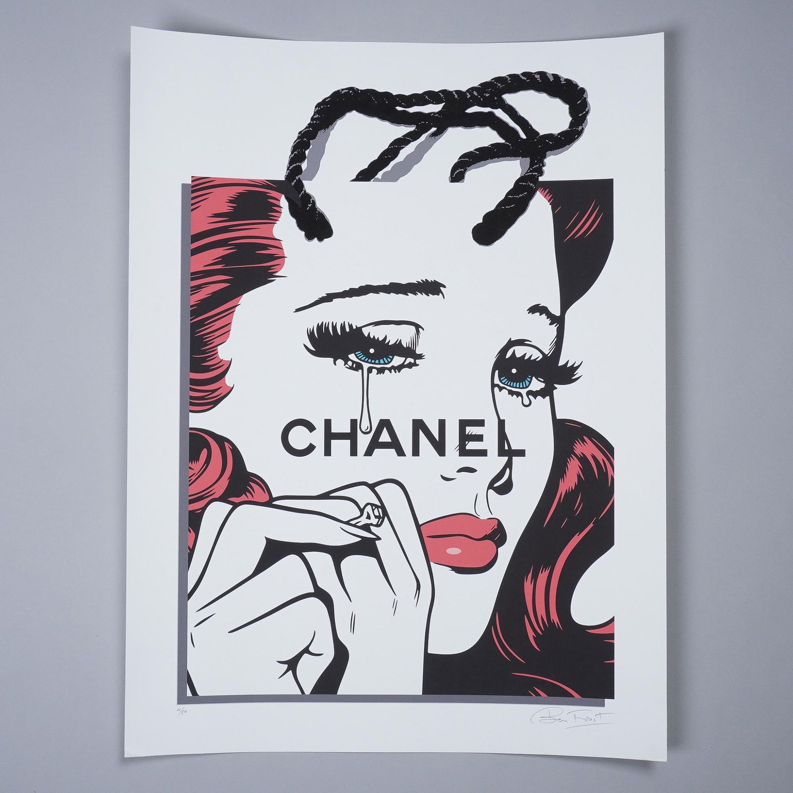 Ben Frost Limited Edition Print, Fashion Victim: Ben Frost's Chanel Girl is a striking commentary on consumer culture, blending pop art aesthetics with high-fashion iconography. This limited edition print, numbered 4 of 50, features Frost's signatur