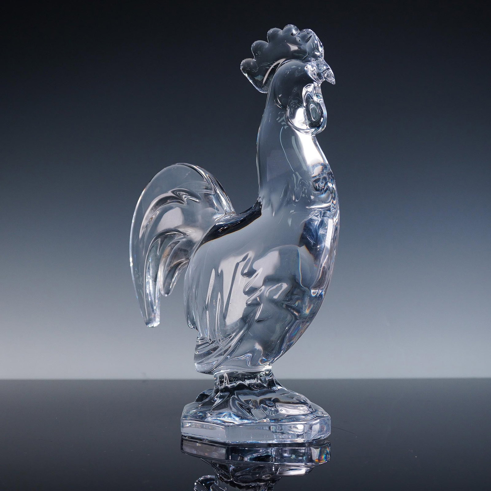 Cristal de Sevres Glass Sculpture, Rooster: This finely crafted crystal rooster figurine by Cristal de Sevres exemplifies the French luxury glassmaker's precision and elegance. Rendered in clear lead crystal, the sculpture captures the regal st