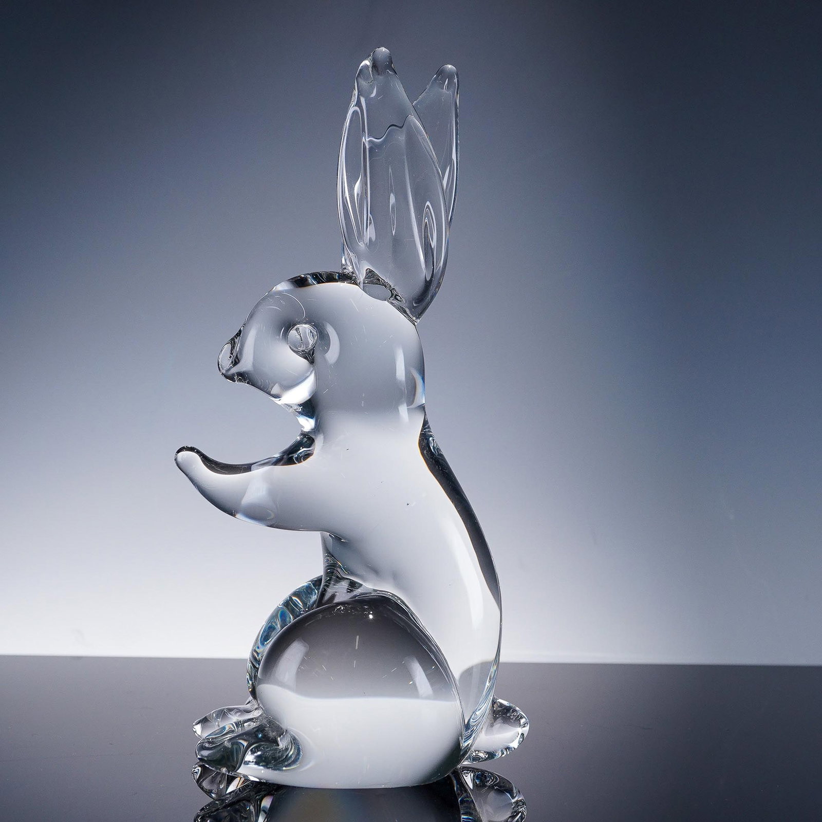 Ronneby Sweden Crystal Figurine, Rabbit: This clear crystal figurine by Ronneby Sweden captures the playful and alert stance of a rabbit with beautifully crafted ears and a polished finish that catches the light. The piece is signed Ronneby 