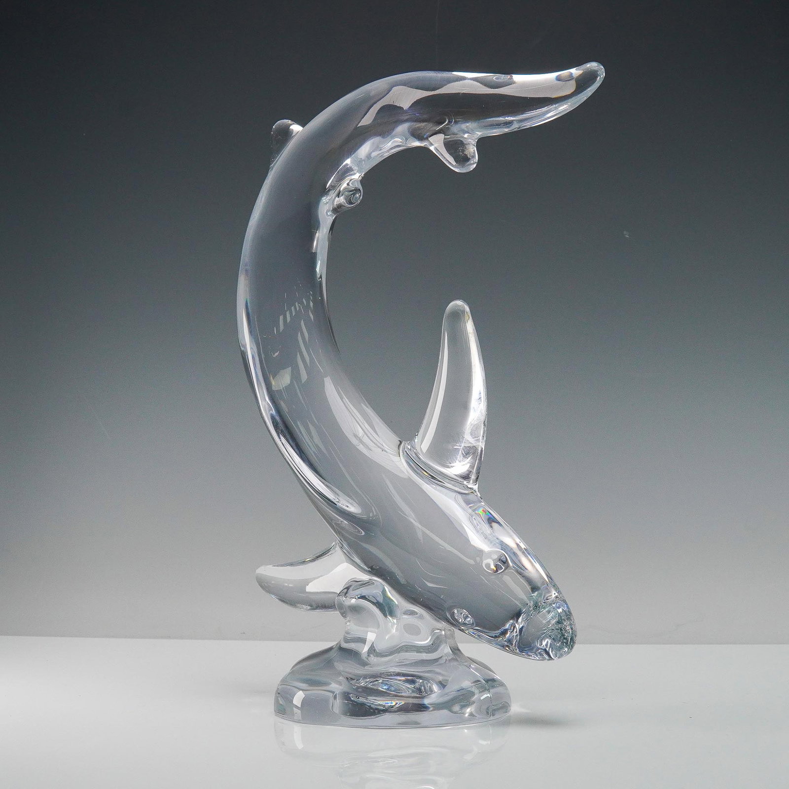 Sevres Crystal Sculpture, Shark: Elegant crystal shark sculpture beautifully capturing the fluid motion. Crafted from clear crystal with a polished finish capturing the essence of this cartilaginous fish, on a round base with gracefu