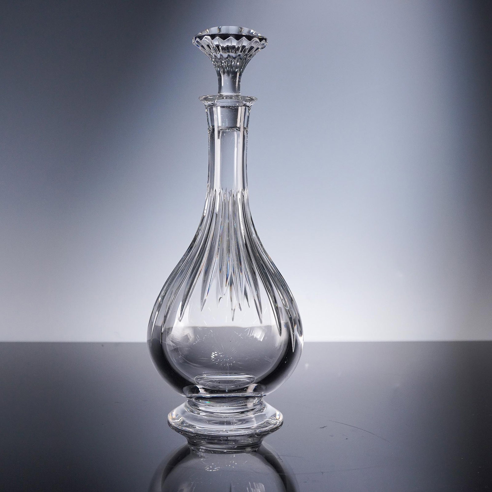 Baccarat Crystal Massena Wine Decanter with Stopper: Brilliantly crafted in clear crystal, this Baccarat Massena Wine Decanter is a testament to refined elegance and exceptional craftsmanship. The decanter features deep bevel-cut vertical fluting that c