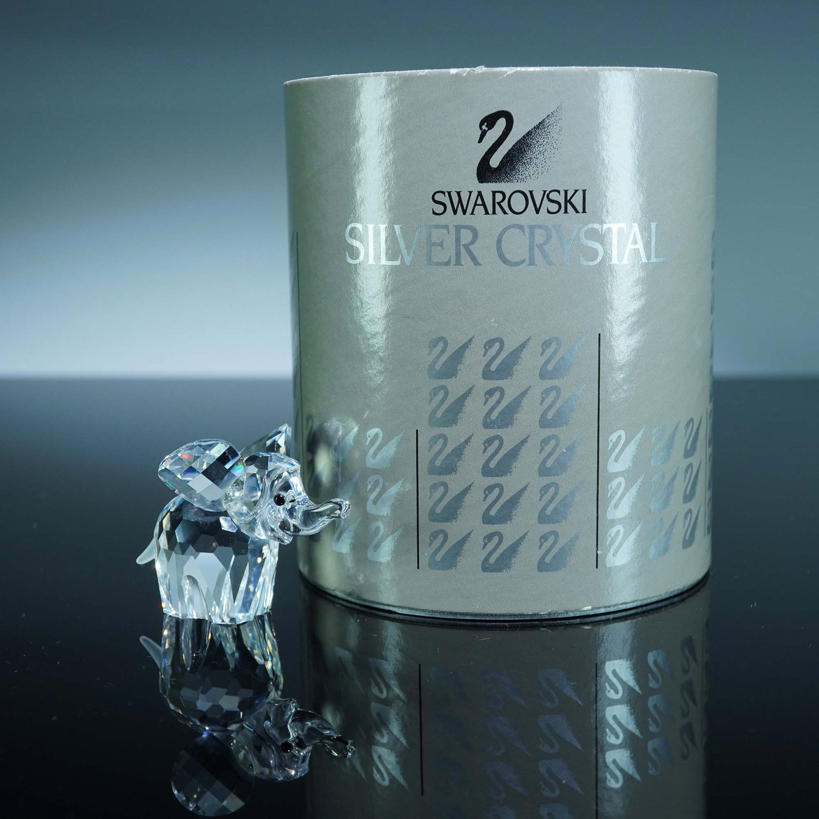 Swarovski Crystal Figurine, Elephant - Small: Swarovski crystal figurine of an elephant originally issued as part of the "African Wildlife" group and later reassigned to the "Rare Encounters" theme. The piece is made from clear faceted crystal wi