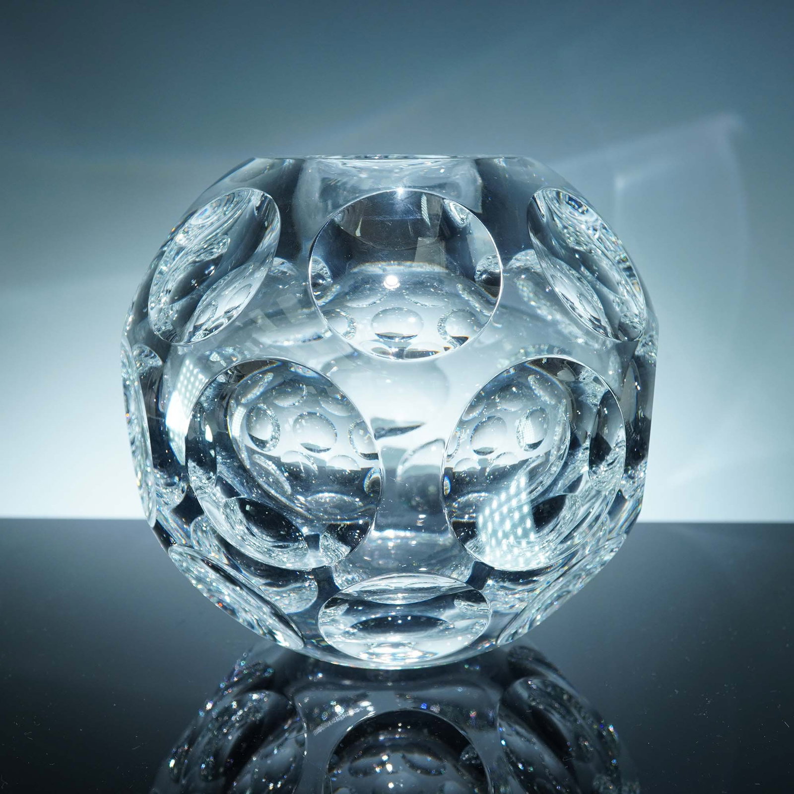 Baccarat Crystal Heritage Pontil Vase: This striking Baccarat Crystal Heritage Pontil Vase showcases the brand's mastery of geometric design through a dazzling composition of circular lens cuts that refract and reflect light with mesmerizi