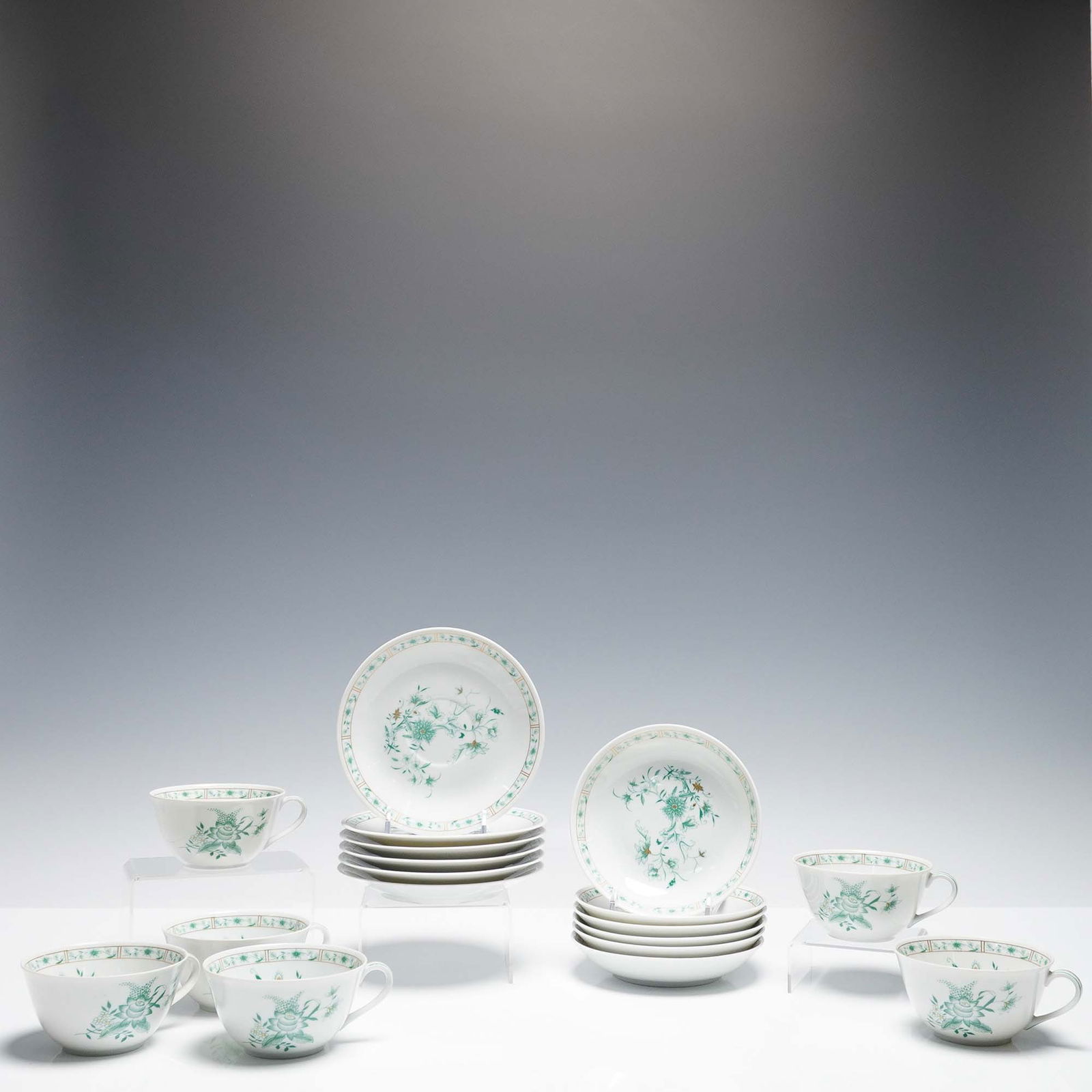 18pc B&Co. Limoges Pekin Porcelain Cup, Saucer and Bowl Set: Elegant 18-piece porcelain set by B&Co. Limoges (L. Bernardaud & Co.), France, in the Pekin pattern. This refined pattern features delicate green floral sprays with subtle gold accents, bordered by a