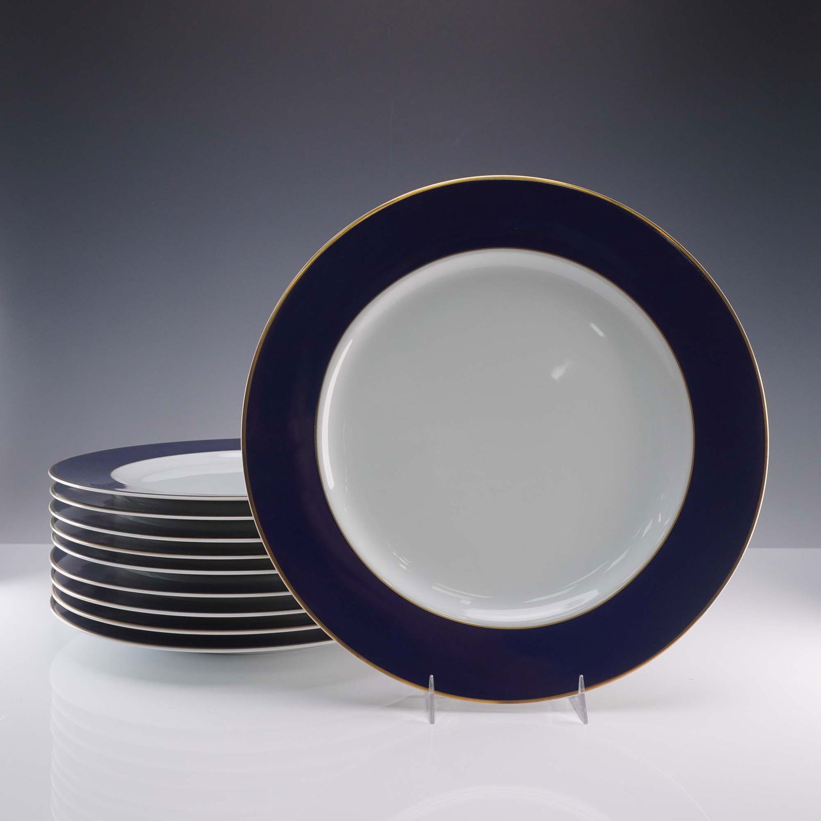 10pc Bernardaud Limoges Dinner Plates, Opaline Bleu de Sevres: Set of 10 elegant dinner plates in the Opaline Bleu de Sevres pattern. These fine plates feature pristine white centers bordered by a rich cobalt blue band, accented with a refined gold rim. Bernardau
