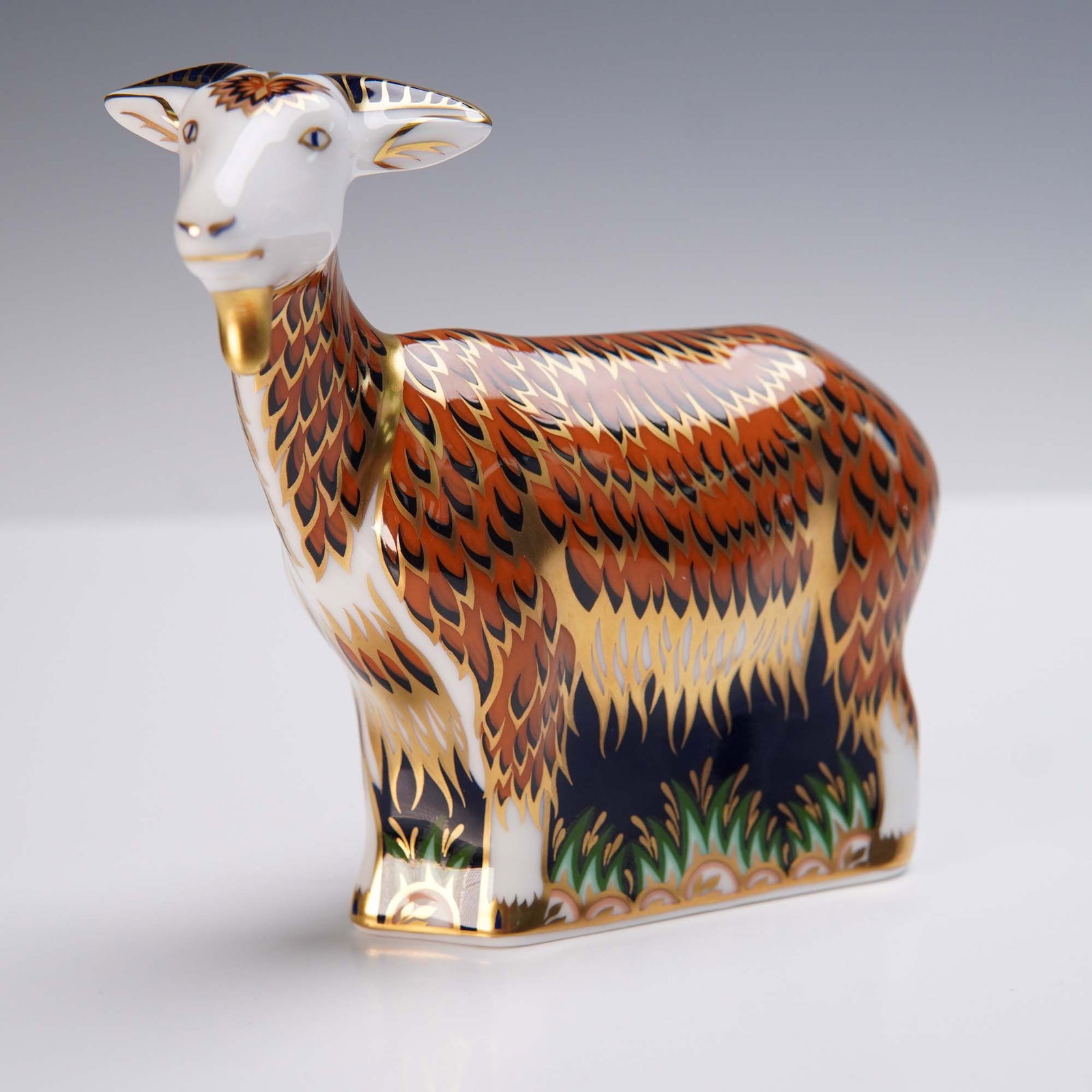 Royal Crown Derby Nanny Goat Figurine: Royal Crown Derby English fine bone china figurine titled Nanny Goat, exclusively available from the Royal Crown Derby Visitors Centre. Dated 2000 and made in England, this collectible features an Ima