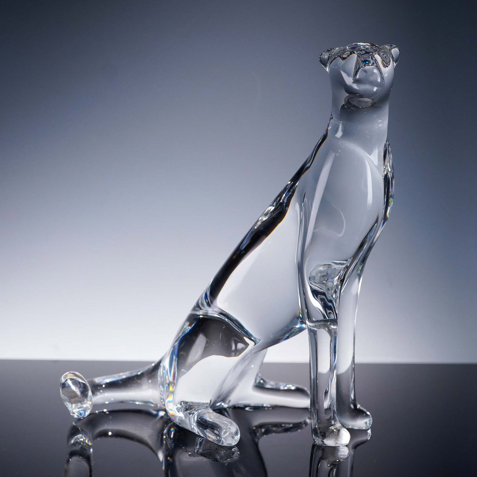 Baccarat Loet Vanderveen Crystal Figurine, Cheetah: Exquisite crystal figure by Loet Vanderveen, designed with sleek modern lines and finely sculpted form. The clear crystal showcases the fluid musculature and graceful posture of the animal in a poised