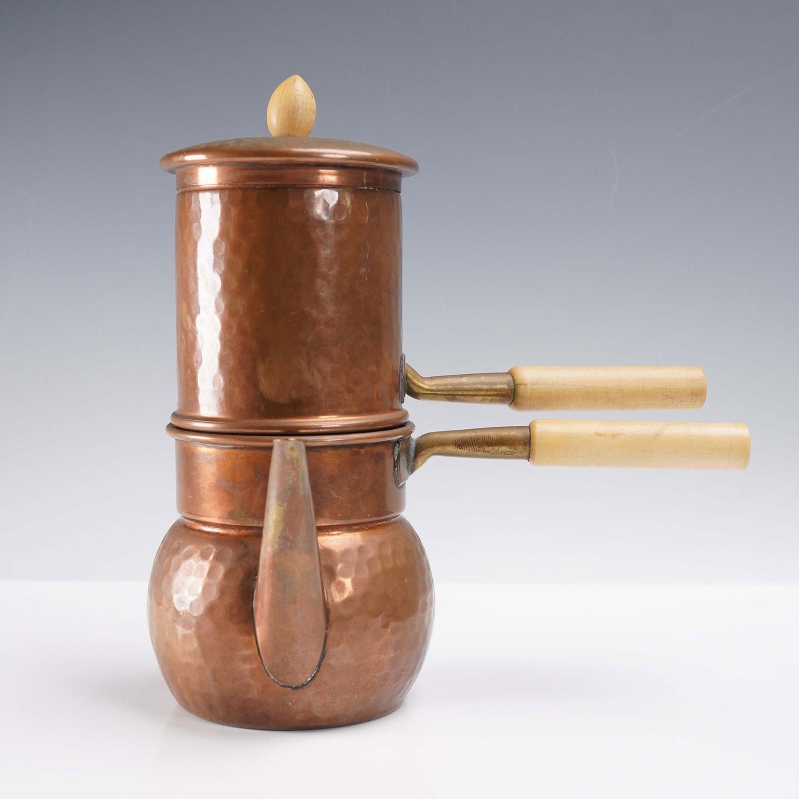 Copper and Brass Neapolitan Coffee Maker: Copper and brass Neapolitan coffee maker in two parts, known as a cuccumella. This piece features a hammered copper surface with subtle dimpled texture throughout the body. The lower chamber is rounde
