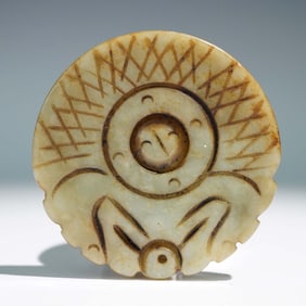 Carved Jade Disc with Incised Motif and Suspension Hole