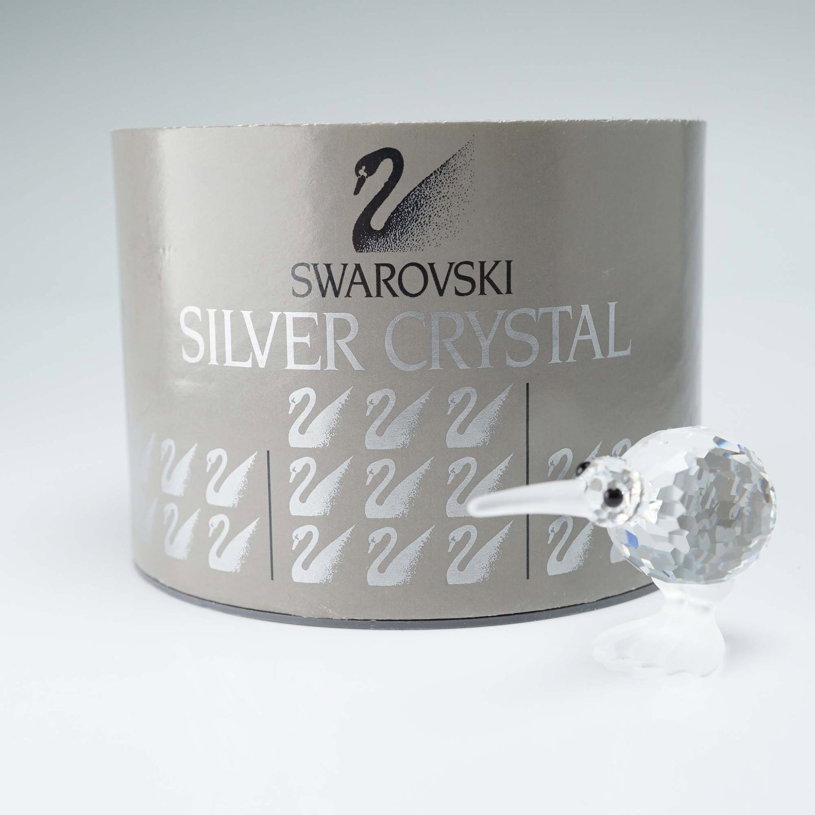 Swarovski Crystal Figurine, Kiwi Bird: Swarovski Silver Crystal figurine in the form of a kiwi bird, featuring a faceted clear crystal body with frosted crystal feet and beak. The piece displays the Swarovski swan backstamp, visible on the