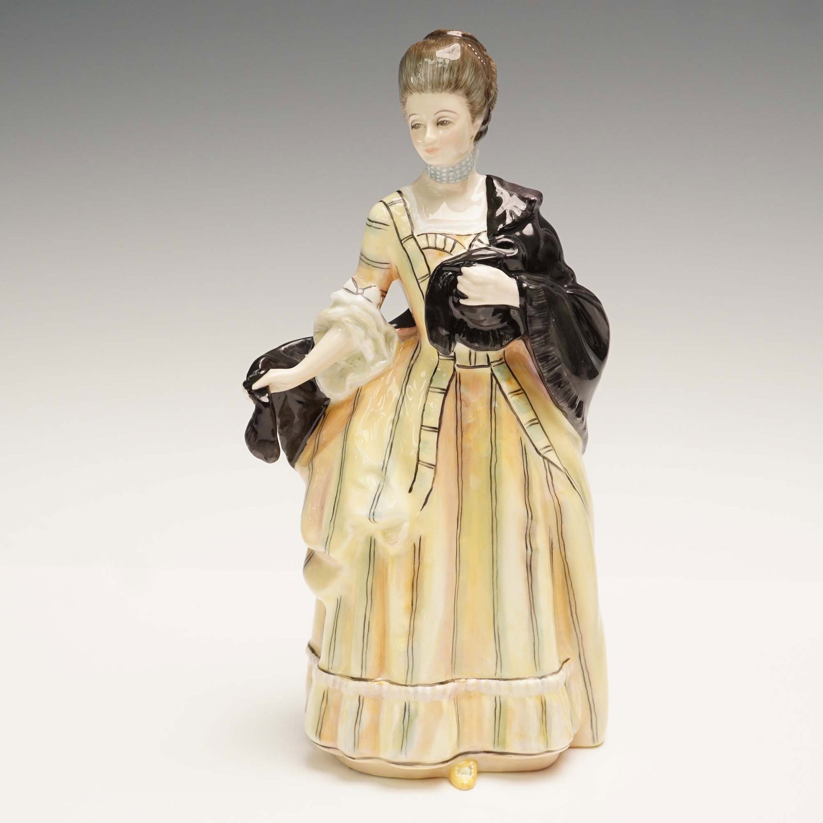 Royal Doulton Figurine, Isabella Countess of Sefton HN3010: This elegant Royal Doulton figurine, titled Isabella, Countess of Sefton, captures the aristocratic grace of a noblewoman in formal attire. Issued in 1989 this figure is hand-decorated and finely dres