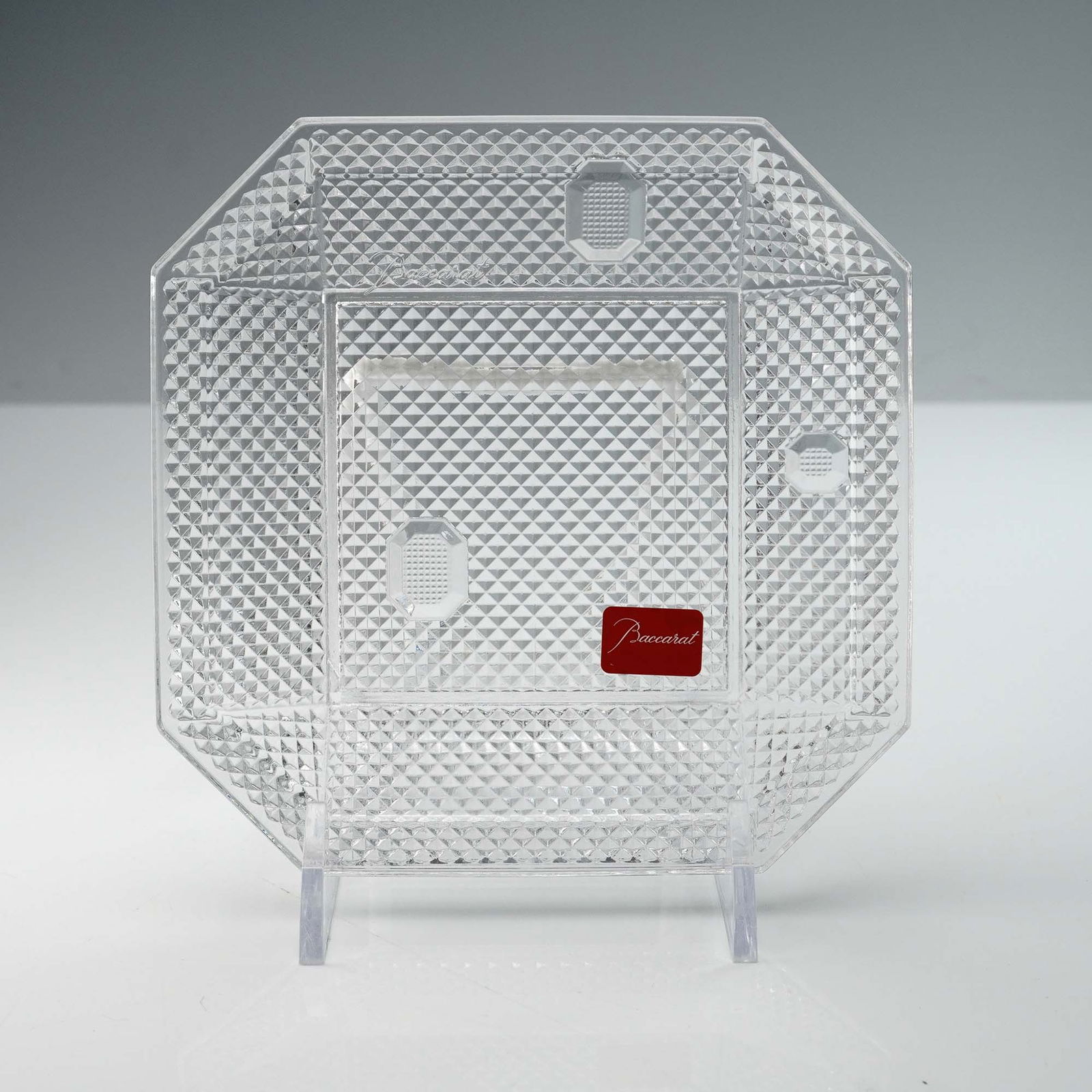 Baccarat Crystal Pampille Plate by Arik Levy: This Baccarat Pampille Plate, designed by renowned artist Arik Levy, exemplifies the fusion of modern design and traditional craftsmanship. The plate features a geometric diamond-cut pattern that capt