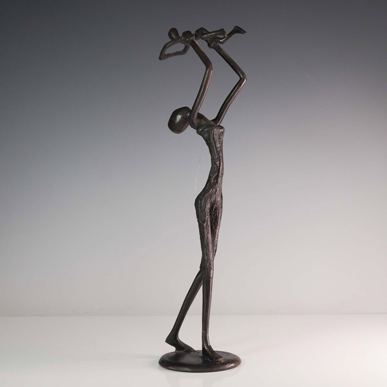 D. Alain Metal Sculpture, Mother and Child at Play: This expressive metal sculpture by D. Alain (20th century) captures a tender moment between a mother and child, rendered in a stylized modern form. Titled Mother and Child at Play, the work shows an e