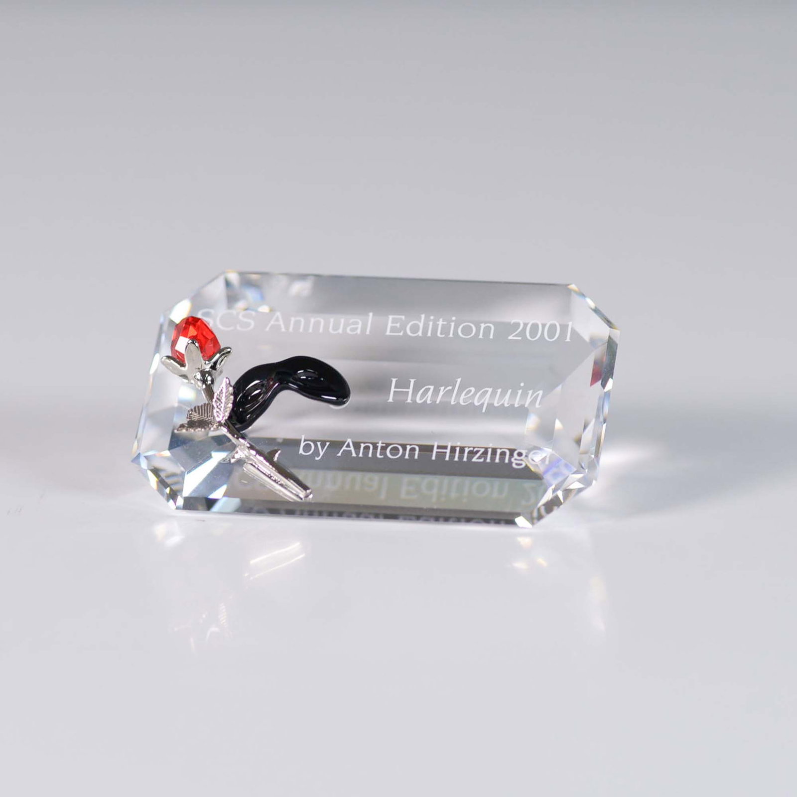 Swarovski SCS AE 2001 Harlequin Plaque: Swarovski SCS Annual Edition 2001 Harlequin Plaque, designed by Anton Hirzinger. This elegant rectangular plaque features an engraved inscription reading SCS Annual Edition 2001 Harlequin by Anton Hir