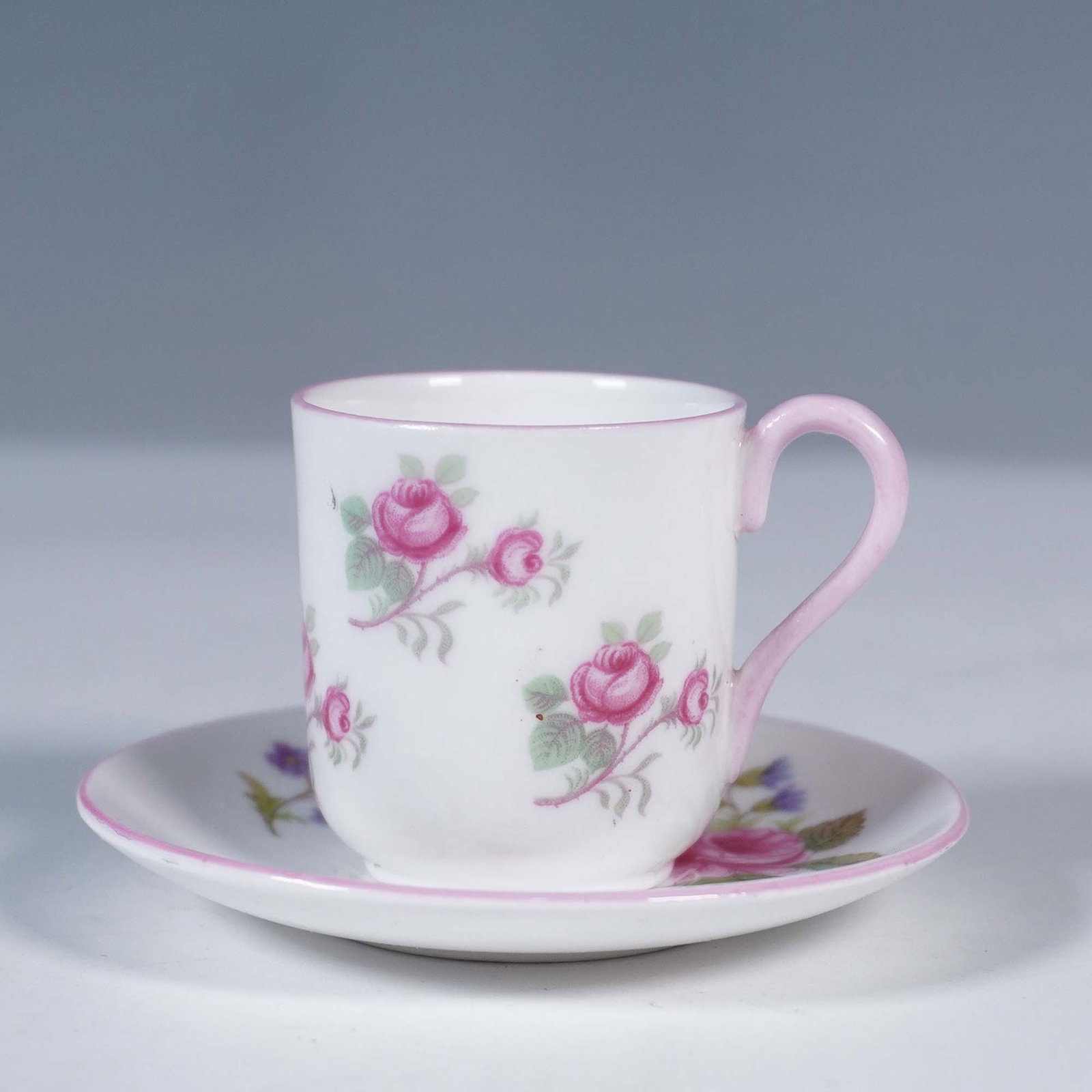Shelley Fine Bone China Rose Spray Toy Cup and Saucer: Shelley England fine bone china toy cup and saucer set in the Rose Spray pattern, number 13545. This miniature set features charming pink rosebuds with green foliage and a delicate pink rim and handle