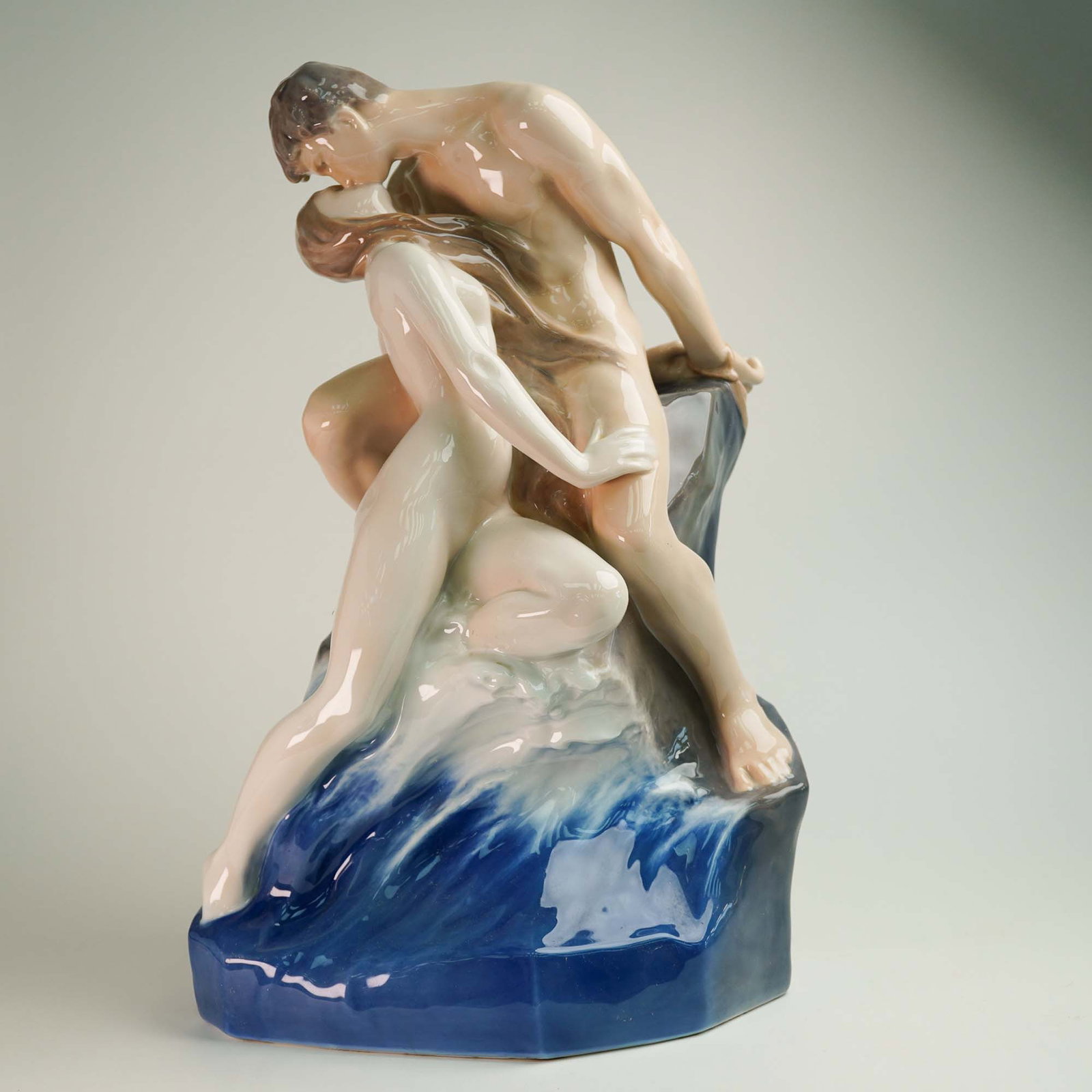 Royal Copenhagen Art Nouveau Porcelain Figurine, The Wave & the Rock: A breathtaking masterpiece of Art Nouveau porcelain, this Royal Copenhagen figurine titled The Wave and the Rock, model number 1152, captures the raw passion and drama of nature and human emotion. Des