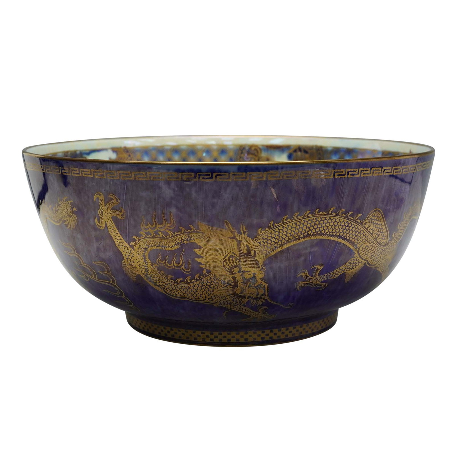 Wedgwood Fairyland Lustre, Celestial Dragon Z4829: The exterior surface is finished in a mixed-blue lustre glaze and decorated with a central "Celestial Dragon" encircling the body, accompanied by stylized oriental motifs. The applied design includes 