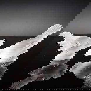 2pc Lalique Crystal Figurines, Birds: Crafted by the esteemed French glassmaker Lalique, this charming pair of frosted crystal bird figurines captures delicate avian beauty in serene, contemplative poses. Featuring exquisite detail in the