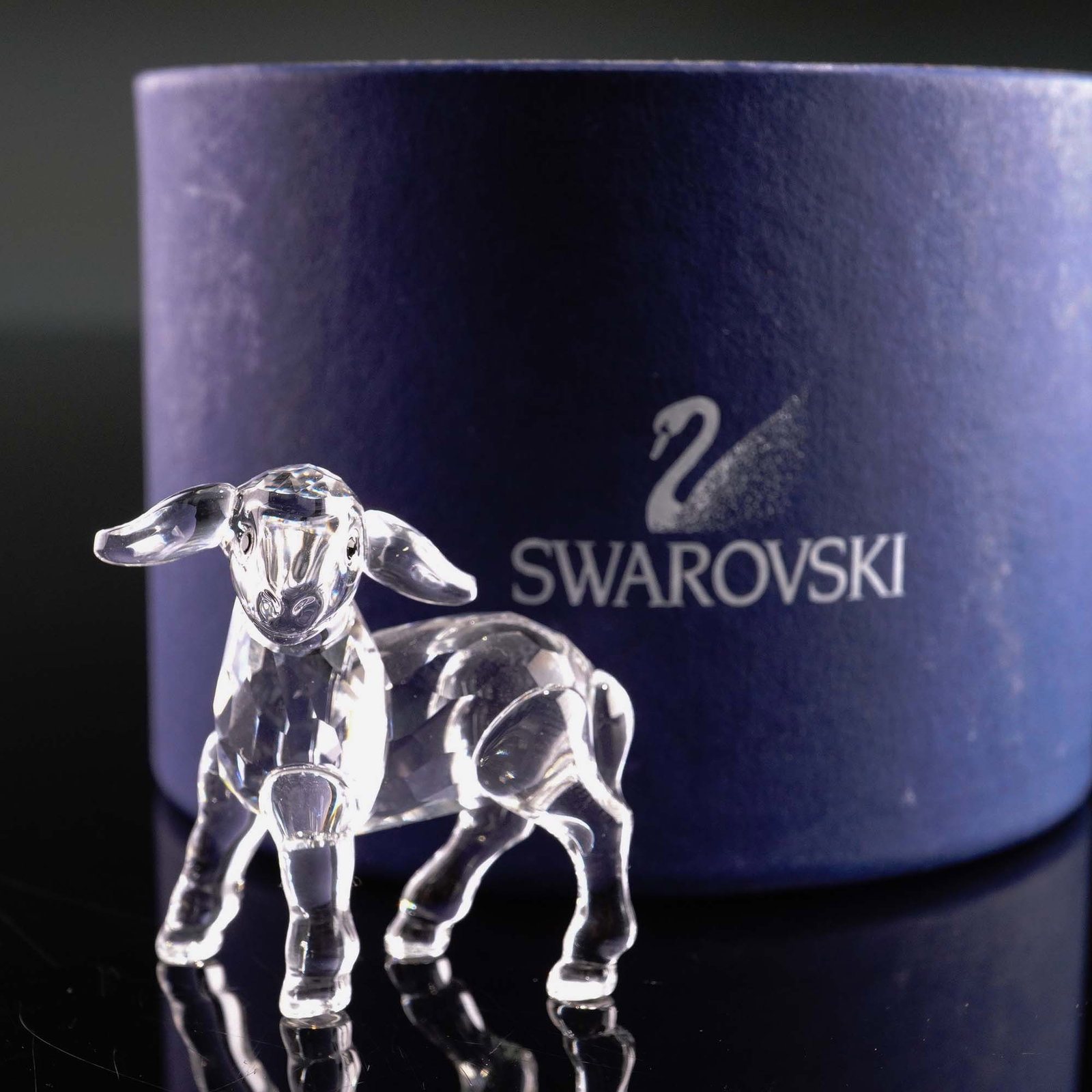 Swarovski Crystal Figurine, Little Lamb: Lead crystal figurine part of the Peaceful Countryside collection. This little lamb is made from clear crystal and is nicely finished with jet crystal eyes. Swarovski backstamp. This item has its orig
