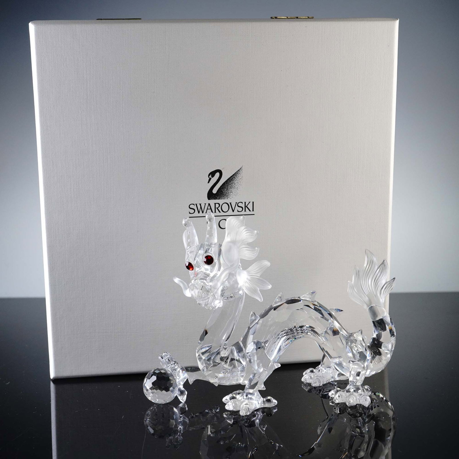 Swarovski Crystal Figurine, Annual Edition Dragon 1997: Released in 1997 as part of Swarovski's coveted Fabulous Creatures trilogy, this Annual Edition Dragon figurine showcases the artistry and precision for which Swarovski is known. Crafted in clear crys