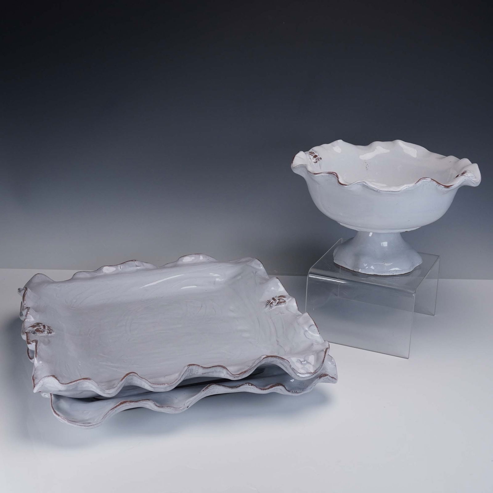 3pc Ceramic Serveware Set, Fleur de Lis by Abigails Italy: A charming 3-piece Italian ceramic serveware set by Abigails, featuring an elegant Fleur de Lis relief design and scalloped rims with rustic hand-glazed edges. This grouping includes a footed bowl and