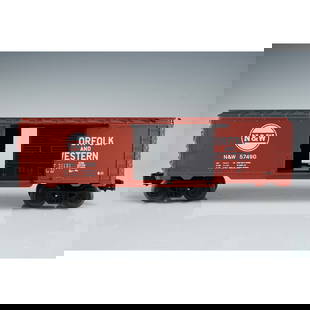 Lionel Boxcar, Norfolk and Western N&W 57490 with Box and Pamphlets: This Lionel model freight car features the Norfolk and Western livery in deep red with white lettering and the N&W logo, model number 57490. The boxcar includes a sliding side door and metal wheels, a