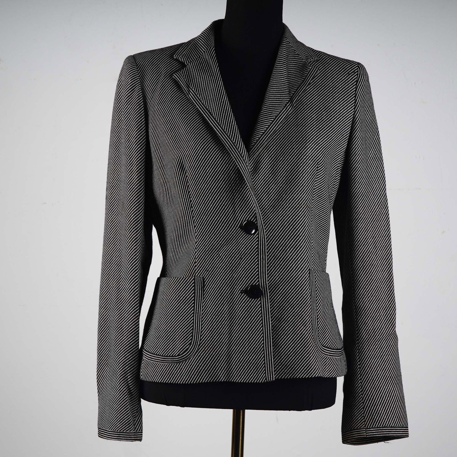 Max Mara Women's Striped Wool Jacket, Size 10: Expertly tailored in Italy, this Max Mara women's jacket presents a refined interpretation of classic suiting. The fitted silhouette features a dynamic black and white diagonal stripe pattern, accente