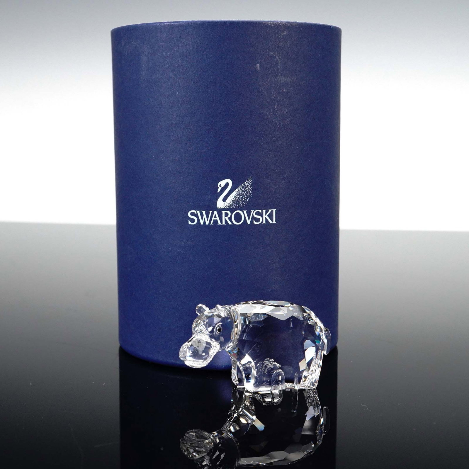Swarovski Crystal Figurine, Hippo: Lead crystal figurine part of the African Wildlife. This hippo is made from clear crystal and is finished delicately with jet crystal eyes. Swarovski backstamp. This item has its original box. Box mea