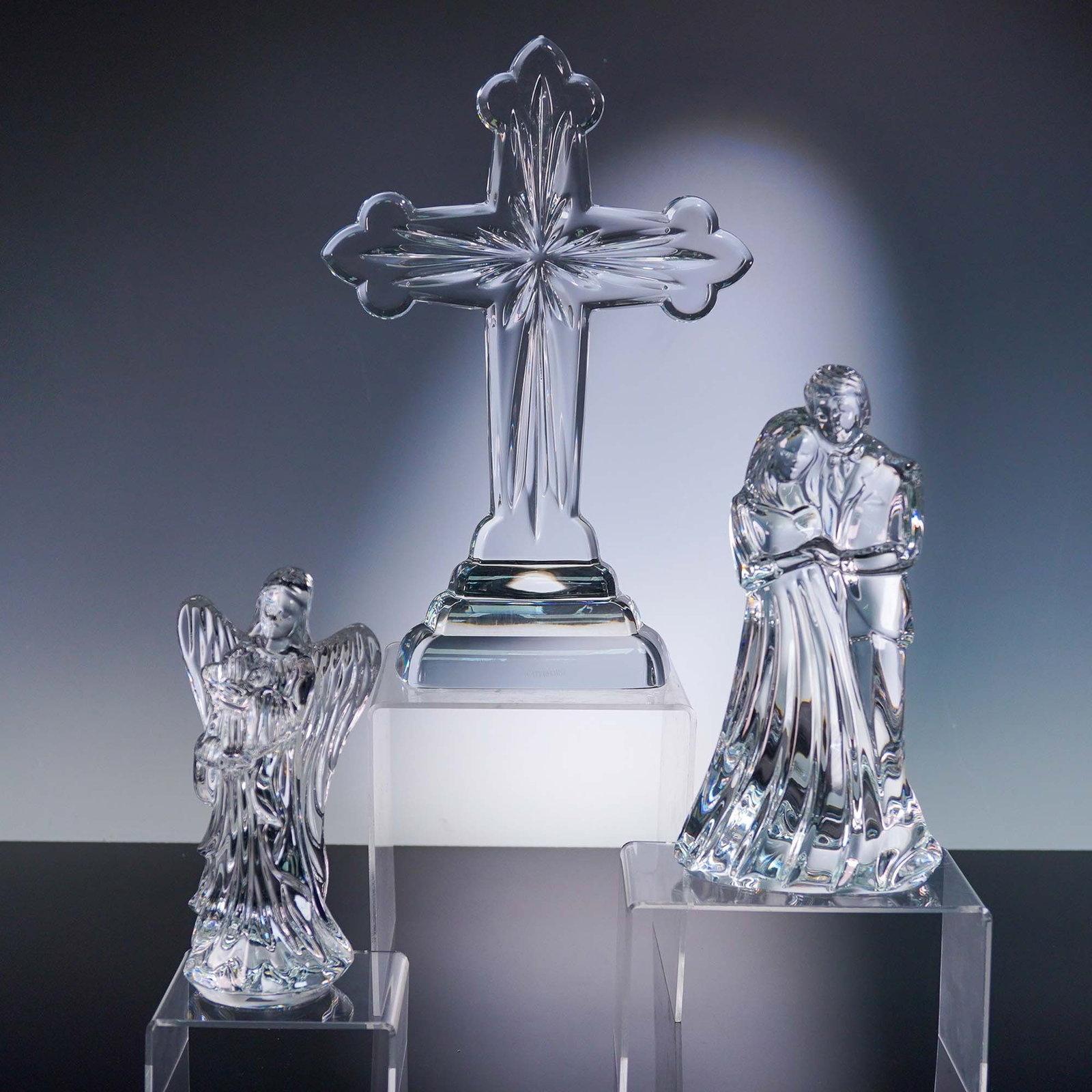 3pc Waterford Crystal Figurines, Cross, Couple and Angel: This lot comprises three late-20th-century Waterford crystal figurines"a finely faceted Celtic cross, an embracing couple and a serenely posed angel"each rendered in lead-crystal clarity with signatur