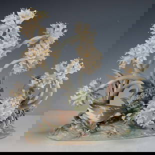 Lladro Porcelain Figurine, The Forest 1001243: Limited edition composition featuring delicate trumpet shaped white flowers with yellow stamens and perched birds among elegant swirling foliage. Lladro backstamp. Certificate of Authenticity