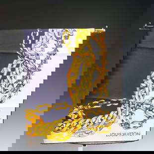 Louis Vuitton Silk Scarf, Gold Chain Print: A luxurious Louis Vuitton silk scarf featuring an intricate gold chain motif printed against a navy blue and ivory background. The elegant design includes signature Louis Vuitton details such as padlo