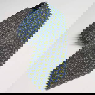 Hermes Silk Tie, Blue and Green Equestrian Pattern: This authentic Hermes Paris silk tie features a refined equestrian-themed pattern woven in bright green against a rich blue background. The design includes stylized hourglass emblems and dynamic horse
