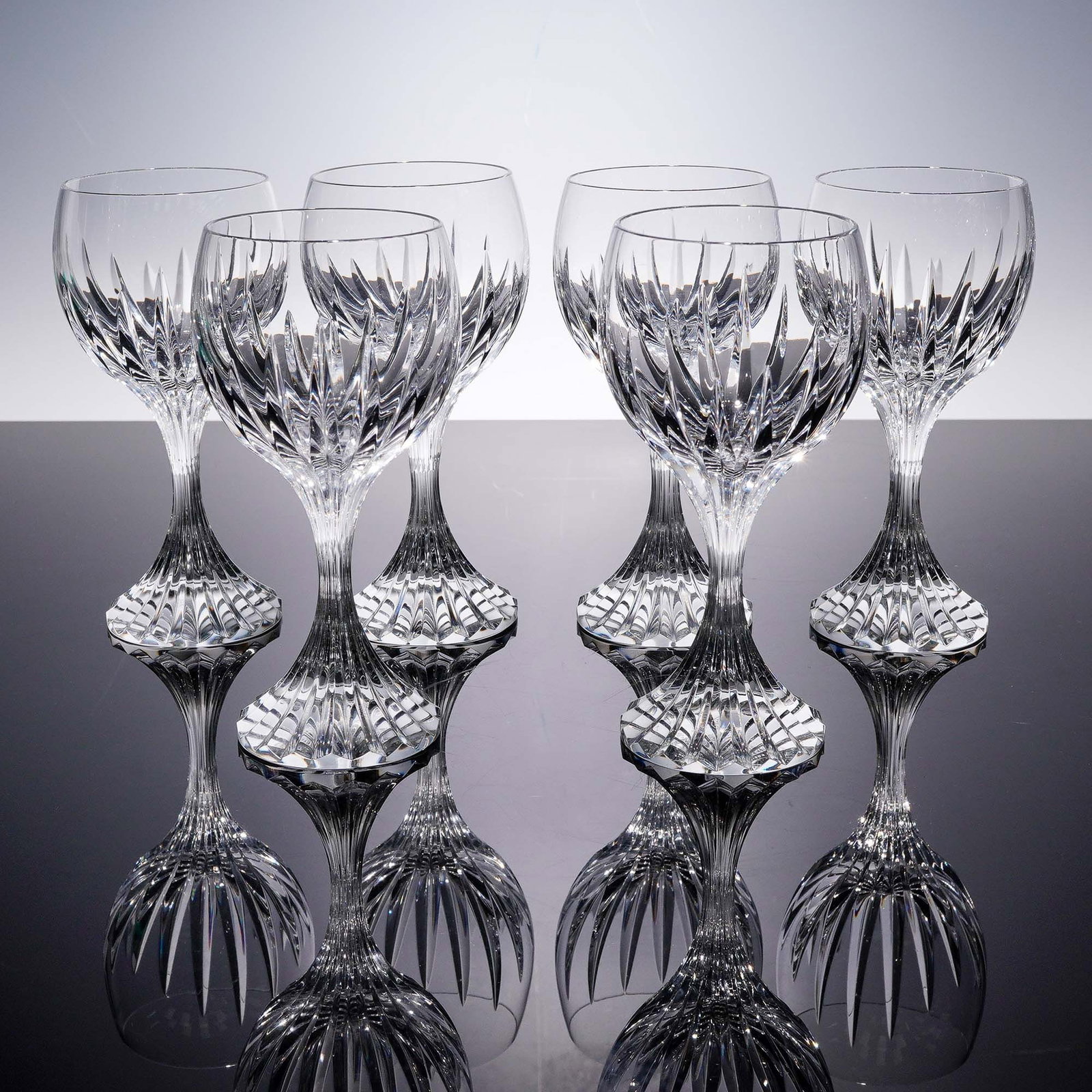 6pc Baccarat Crystal Wine Glasses, Massena: This 6 piece set of wine glasses by Baccarat Crystal features the distinguished Massena pattern, celebrated for its deep bevel cuts and radiant clarity. Each glass stands approximately 6.5"H and is ex