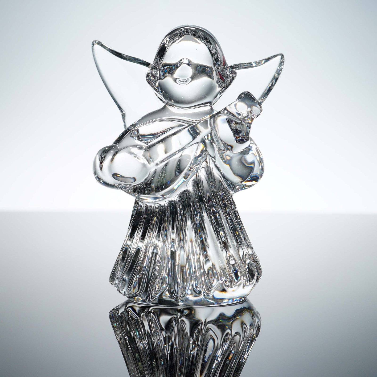 Baccarat Crystal Figurine, Angel with Mandolin with Box: This Baccarat crystal angel figurine is finely crafted in brilliant clear crystal and features a serene angel playing a mandolin, with delicately formed wings and flowing robes. The figurine bears the