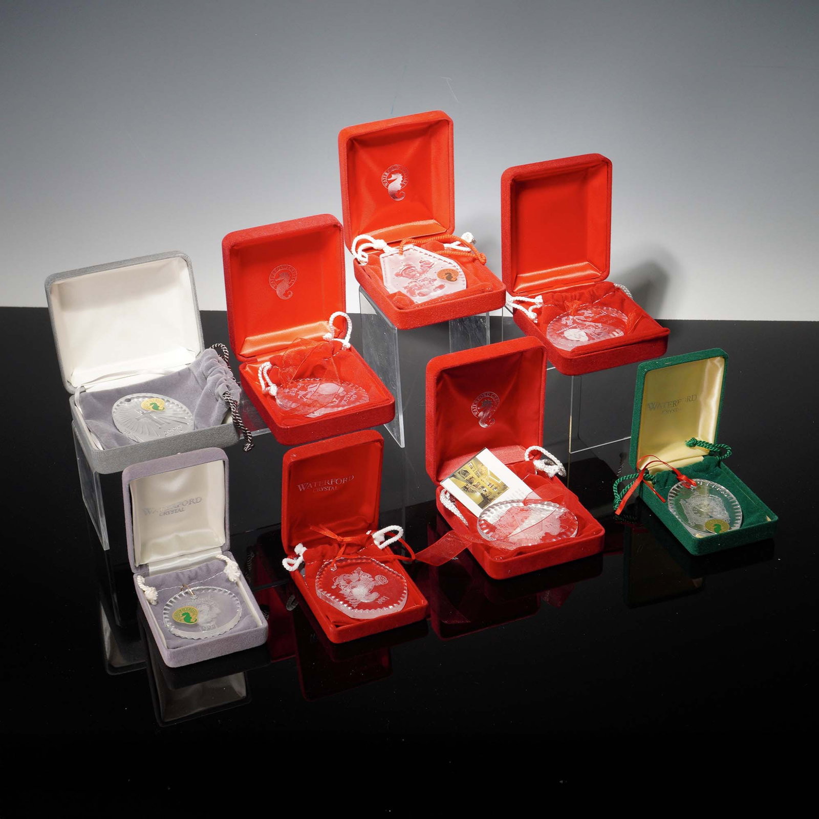 8pc Waterford Crystal Festive Tree Ornaments: Elegant collection featuring six Disney tree ornaments including Mickey and Donald. This collection also includes two Christianity ornaments and one titled Festival of Trees. The ornaments are precisi
