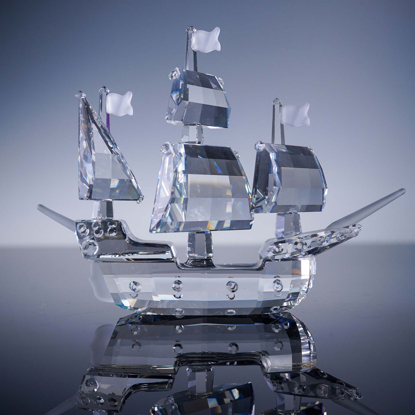 Swarovski Crystal Figurine, Santa Maria 162882: This Swarovski crystal figurine represents the Santa Maria ship, part of the Swarovski "When We Were Young" series. Expertly crafted in faceted clear crystal, the detailed three-masted sailing vessel