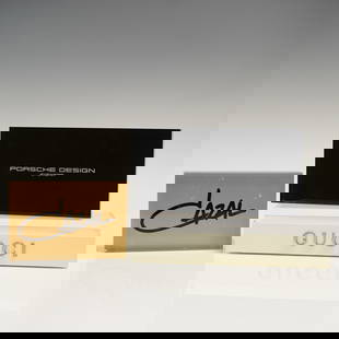 Trio of Acrylic Designer Display Signs: This lot includes three high'quality acrylic signage blocks from premier eyewear brands. Each sign bears the iconic logo of its label"Cazal, Porsche Design Eyewear, and Gucci"in crisp lettering on cle