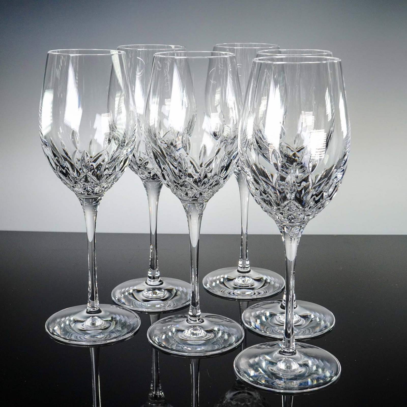 6pc Waterford Crystal Lismore Wine Glasses Set: This stunning 6-piece set of wine glasses by Waterford features the timeless Lismore pattern, characterized by its brilliant diamond and vertical wedge cuts that reflect light with elegance and clarit