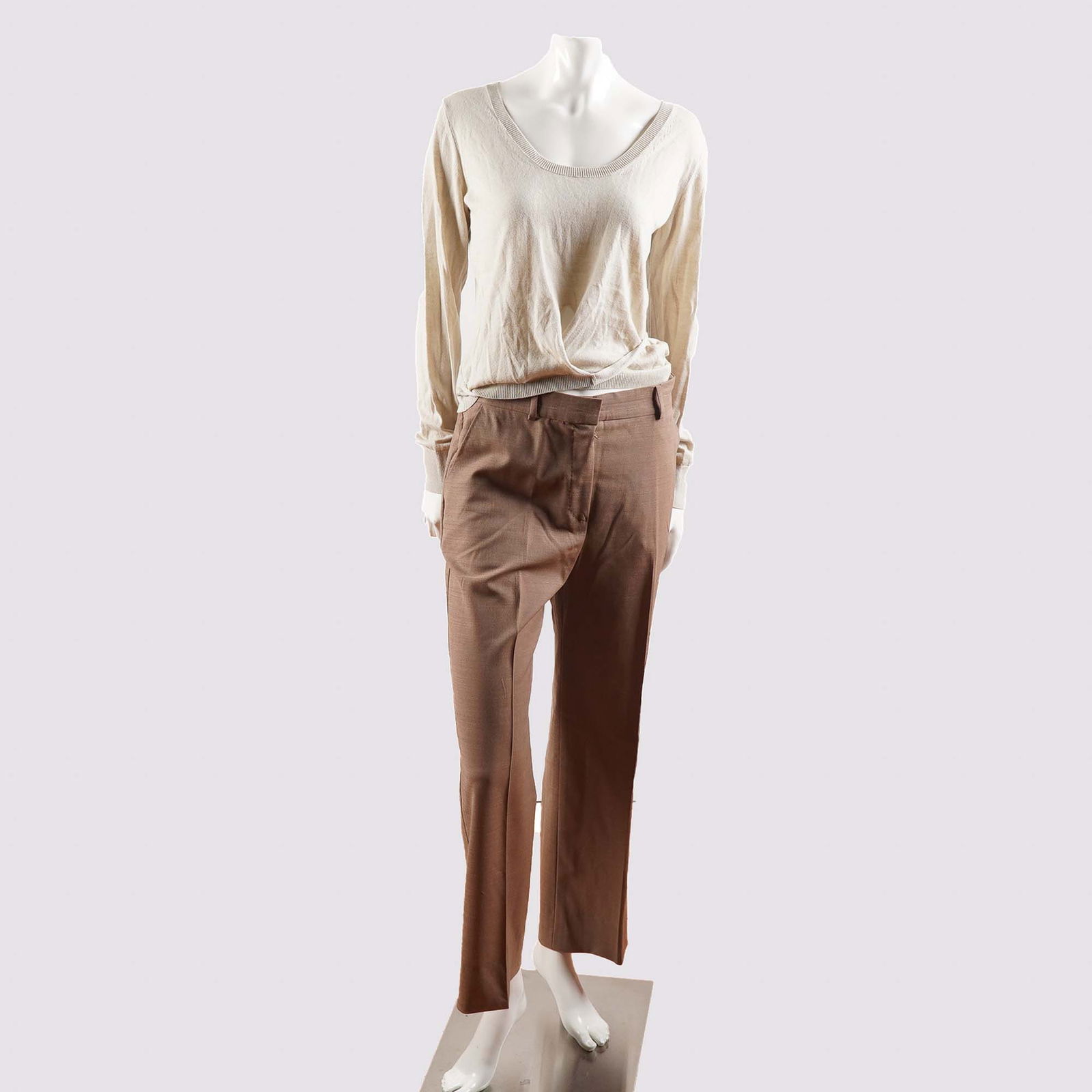 Max Mara Knit Sweater and Trousers Set: This Max Mara ensemble features a light beige knit sweater and a pair of high-rise, straight-leg brown trousers. The sweater, crafted in Italy from fine knit fabric, boasts a relaxed fit with long sle