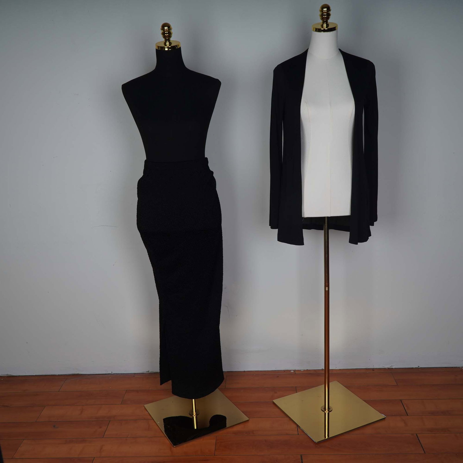 2pc Women's Black Skirt and: Elegant and timeless, this 2-piece black ensemble from Lesley Sandra of Sheffield features a classic knit design ideal for versatile styling. The set includes a textured black pencil skirt with a subt