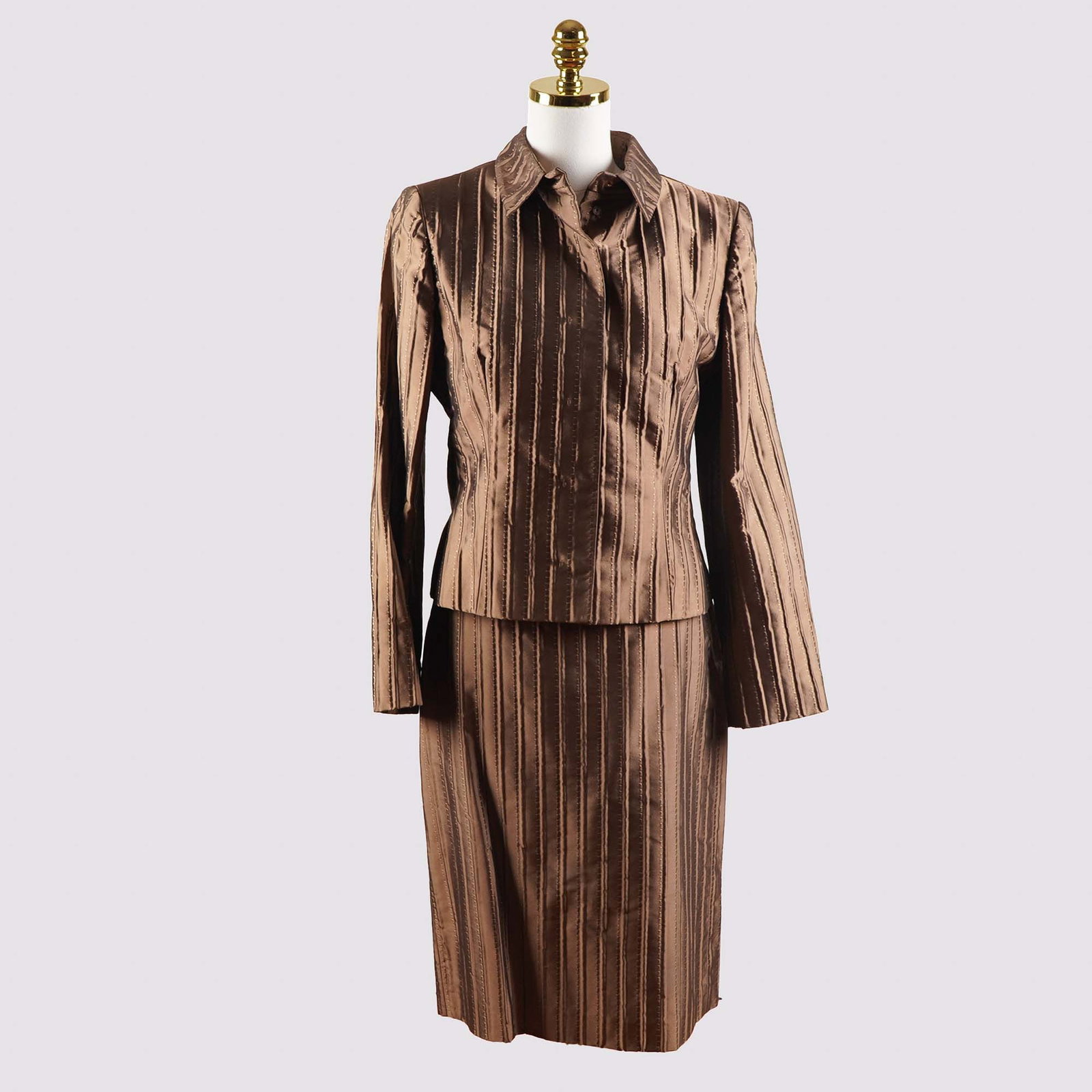 3 pc Valentino Roma Bronze Striped Skirt Suit, Size 10: Expertly crafted from luxurious bronze silk with a subtle sheen, this sophisticated 3-piece skirt suit by Valentino Roma includes a tailored jacket, a knee-length pencil skirt, and a matching sleevele
