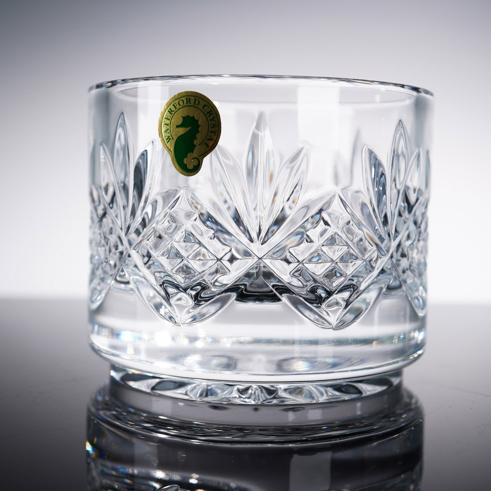 Waterford Crystal Stacking Container, Lismore Diamond Cut: Crafted by the renowned Irish brand Waterford, this sparkling crystal stacking container showcases the elegance and clarity synonymous with their heritage of fine craftsmanship. The piece features the