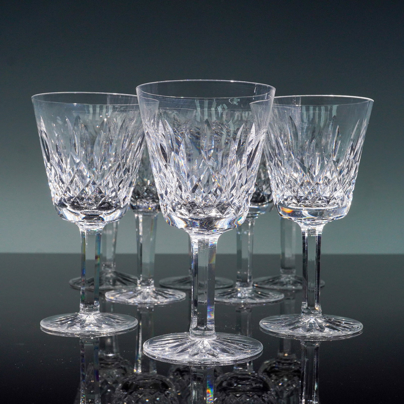 8pc Waterford Crystal Lismore Claret Wine Glasses Set: This stunning set of eight Waterford Crystal Lismore claret wine glasses features the iconic Lismore pattern, celebrated for its elegant diamond and wedge cuts. Each glass is beautifully hand-cut with