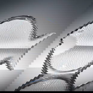 Baccarat Crystal Fish Figurine: Baccarat crystal figurine in the shape of a stylized fish, featuring a clear glass body with frosted and textured detailing to simulate scales and fins. The fish is formed with curved, flowing lines a