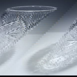 Cut Crystal Vase, Waterford Style Starburst Pattern: Cut crystal vase in the style of Waterford, showcasing an elegant starburst pattern with deeply cut panels, crisscross motifs, and a scalloped rim. This brilliant piece reflects traditional European c