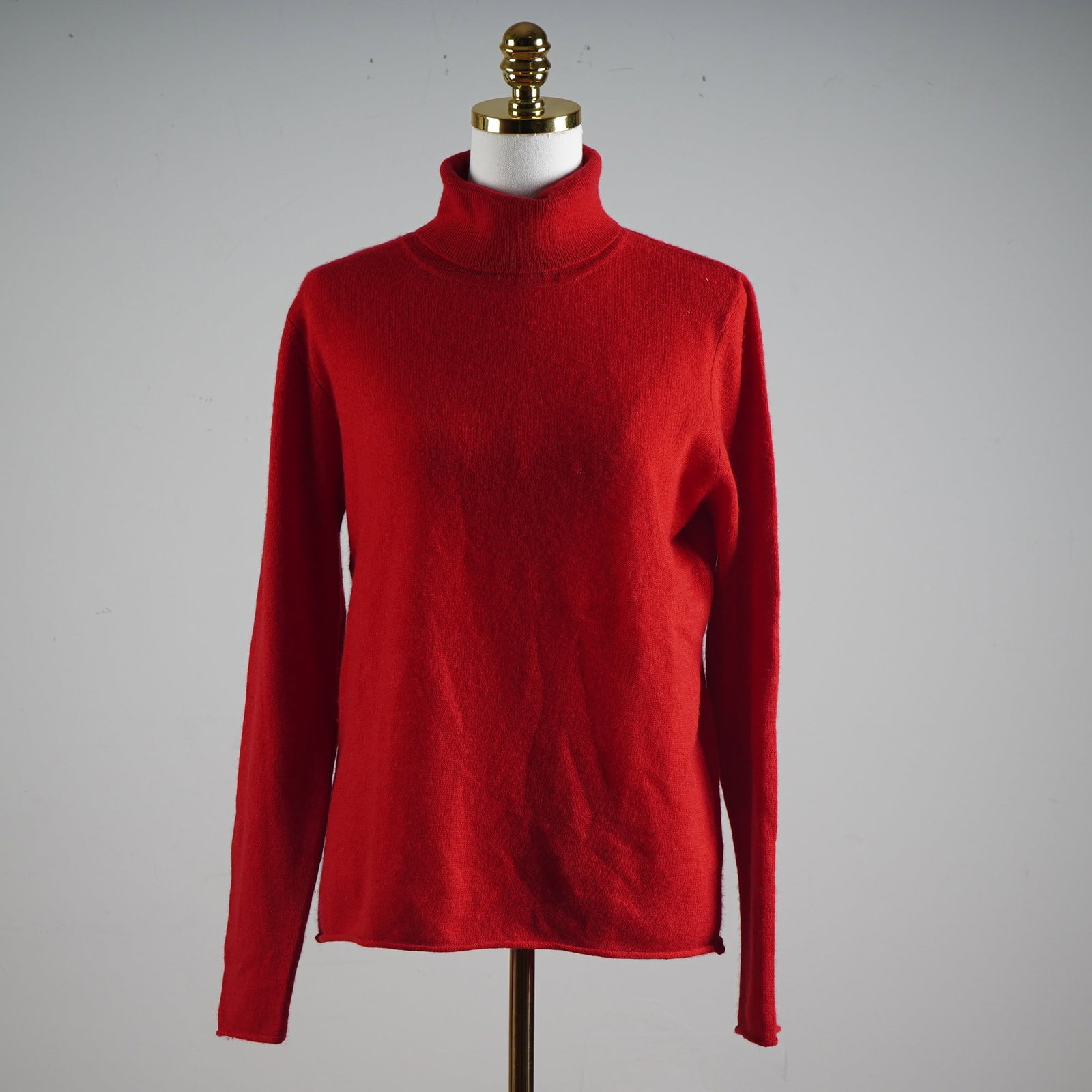 Belle France Pure Cashmere Scarlet Turtleneck Sweater: Wrap yourself in the rich elegance of true luxury with this eye-catching red turtleneck sweater from Belle France. Crafted from sumptuously soft 100% pure cashmere, this piece epitomizes classic Frenc