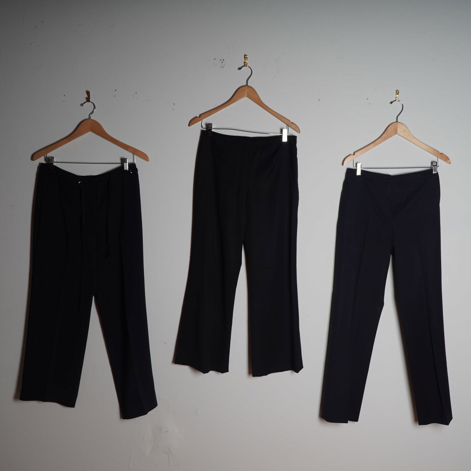 3pc Designer Black Pants, Escada, Valentino, Armani: A chic trio of black designer pants featuring premium labels Escada, Valentino Roma, and Armani Collezioni. The Escada pair is marked EU 38 and crafted in a soft wool blend with 7% elastane for stretc