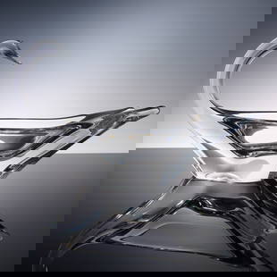 Daum Crystal Swan Bowl: An exceptional signed crystal bowl by Daum, beautifully sculpted in the form of an abstract swan. The sweeping neck and fluid silhouette evoke motion and grace, while the thick, clear crystal glows wi