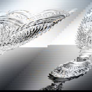 Waterford Crystal Designers Gallery Collection, Sea Spray Bowl: An exceptional crystal pedestal bowl evoking a sense of motion and rhythm through its sweeping ribbon like cuts, which interlace with deep crosshatch and fan motifs across the bowl's body. The undulat