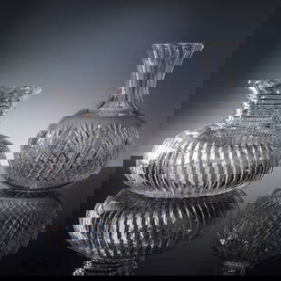 2pc Pair of Cut Crystal Vases, Ribbed and Diamond Fan Designs: A striking pair of cut crystal vases, each showcasing distinctive and elegant craftsmanship. The first features a low, bulbous form with vertical ribbed cuts and a scalloped rim, creating dynamic refl